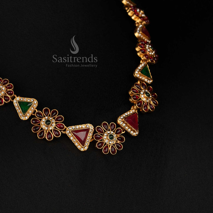 Close-up of the Classic Matte Gold Plated necklace, highlighting its intricate floral, triangular design and sparkling stones.