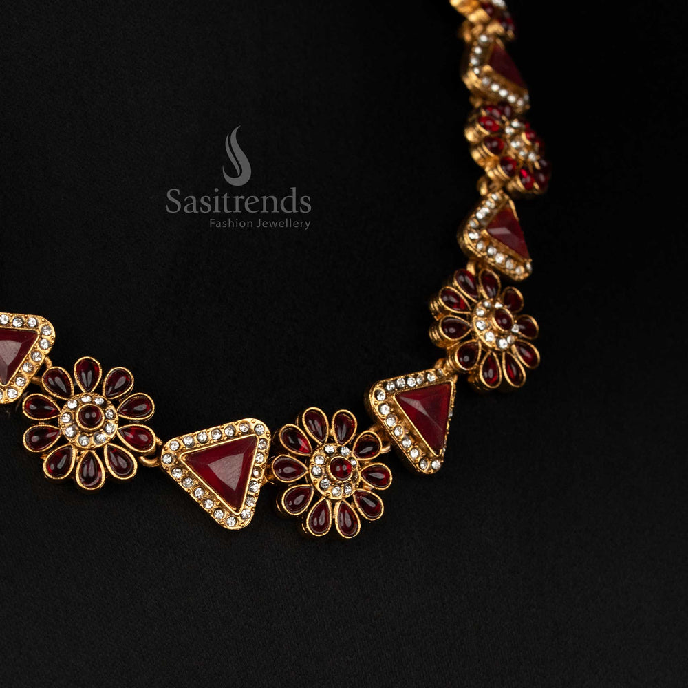 Close-up of the Classic Matte Gold Plated necklace, highlighting its intricate floral, triangular design and sparkling stones - Sasitrends