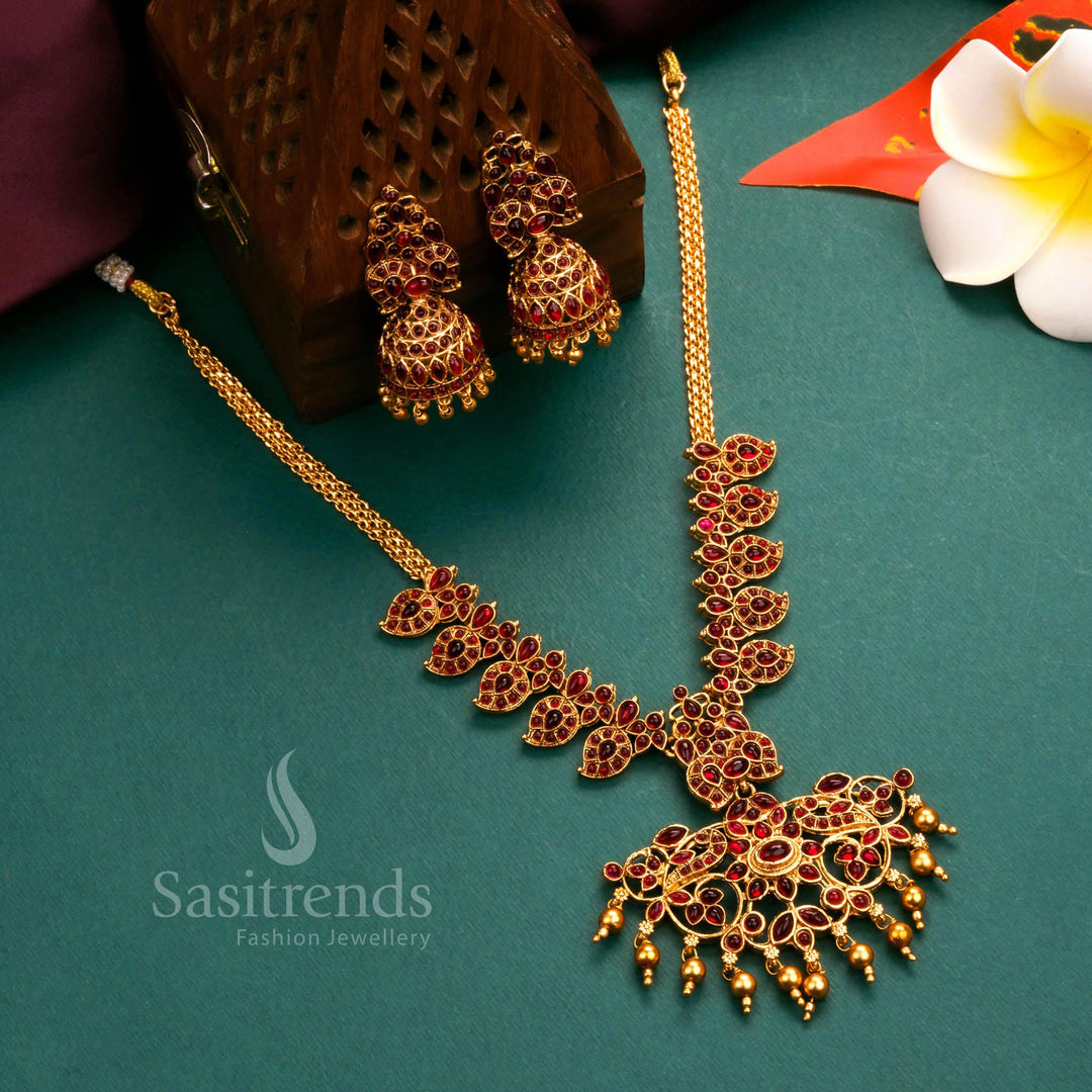 Grand matte gold plated temple flower pendant necklace jewellery set with intricate craftsmanship and radiant ruby stones, ideal for traditional occasions - Sasitrends