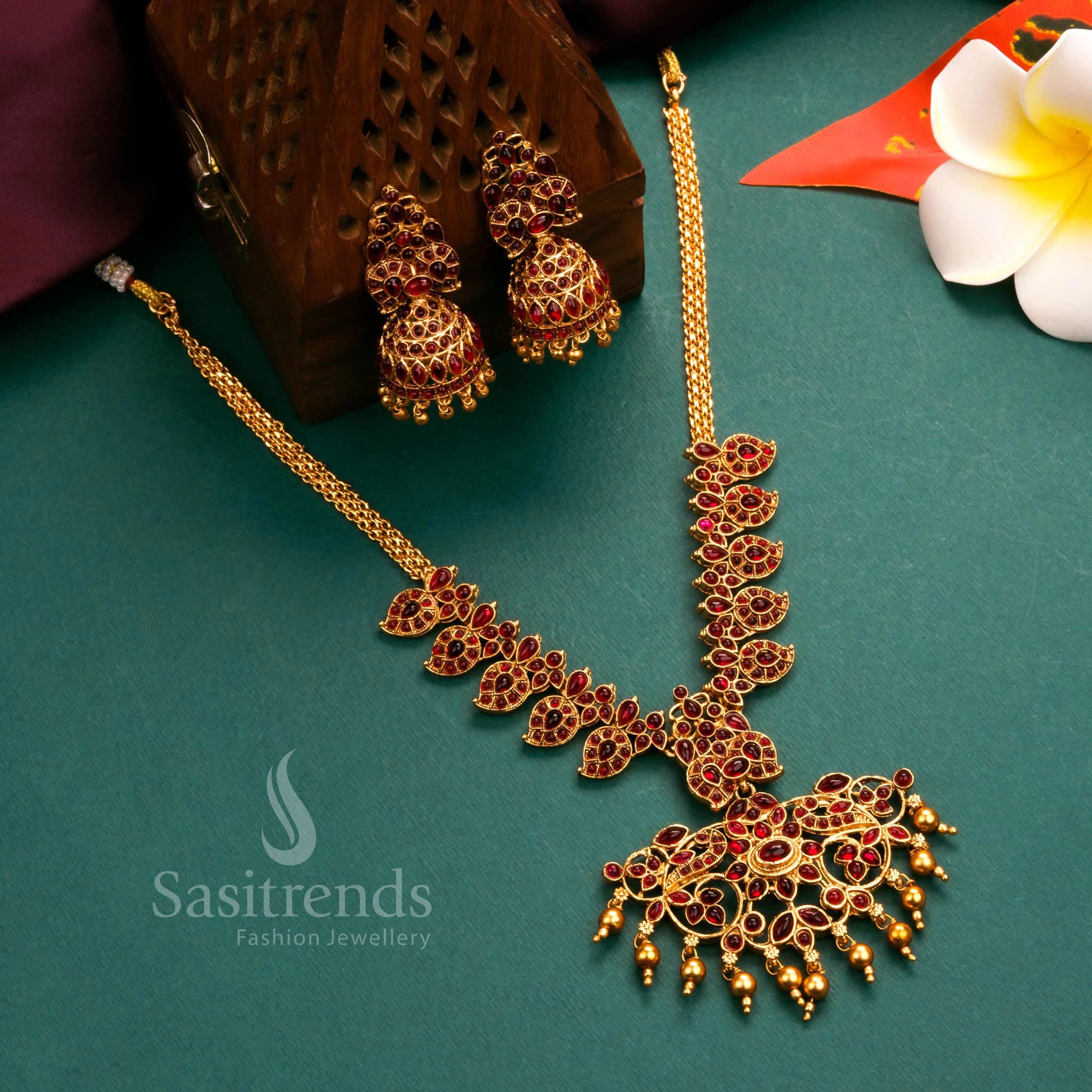 Grand matte gold plated temple flower pendant necklace jewellery set with intricate craftsmanship and radiant ruby stones, ideal for traditional occasions - Sasitrends