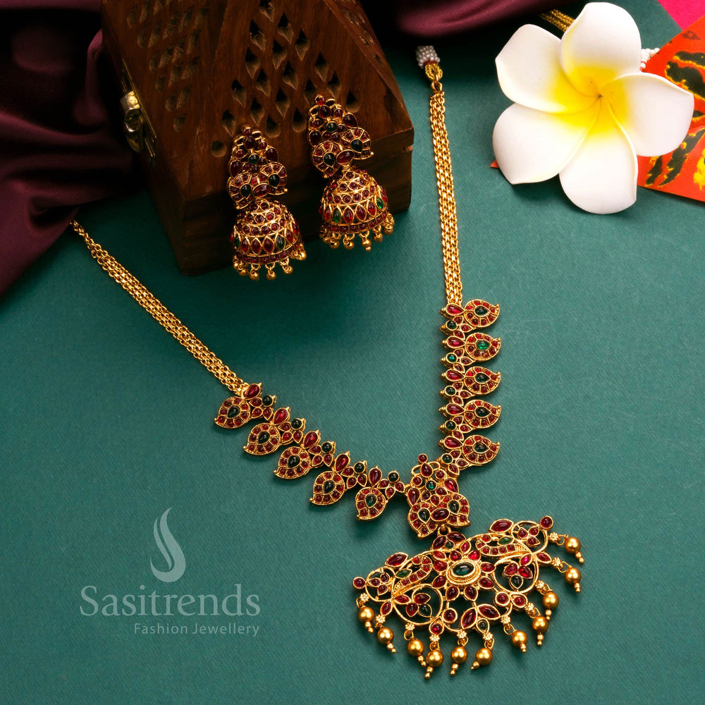 Royal matte gold plated temple flower pendant necklace jewellery set, intricately handcrafted with ruby and green stones to reflect traditional grandeur - Sasitrends