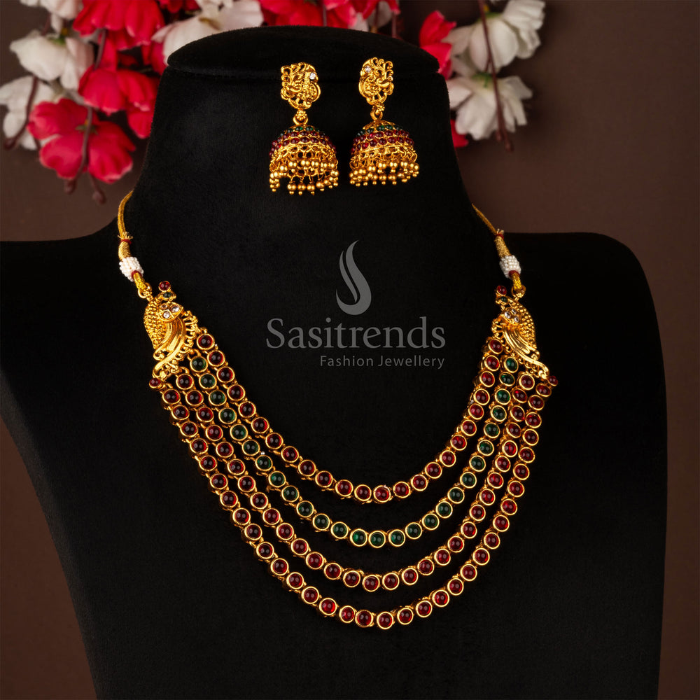 Traditional matte gold peacock temple necklace jewellery set beautifully crafted with ruby-green kemp stones, paired with classic jhumka earrings for an authentic South Indian heritage style - Sasitrends