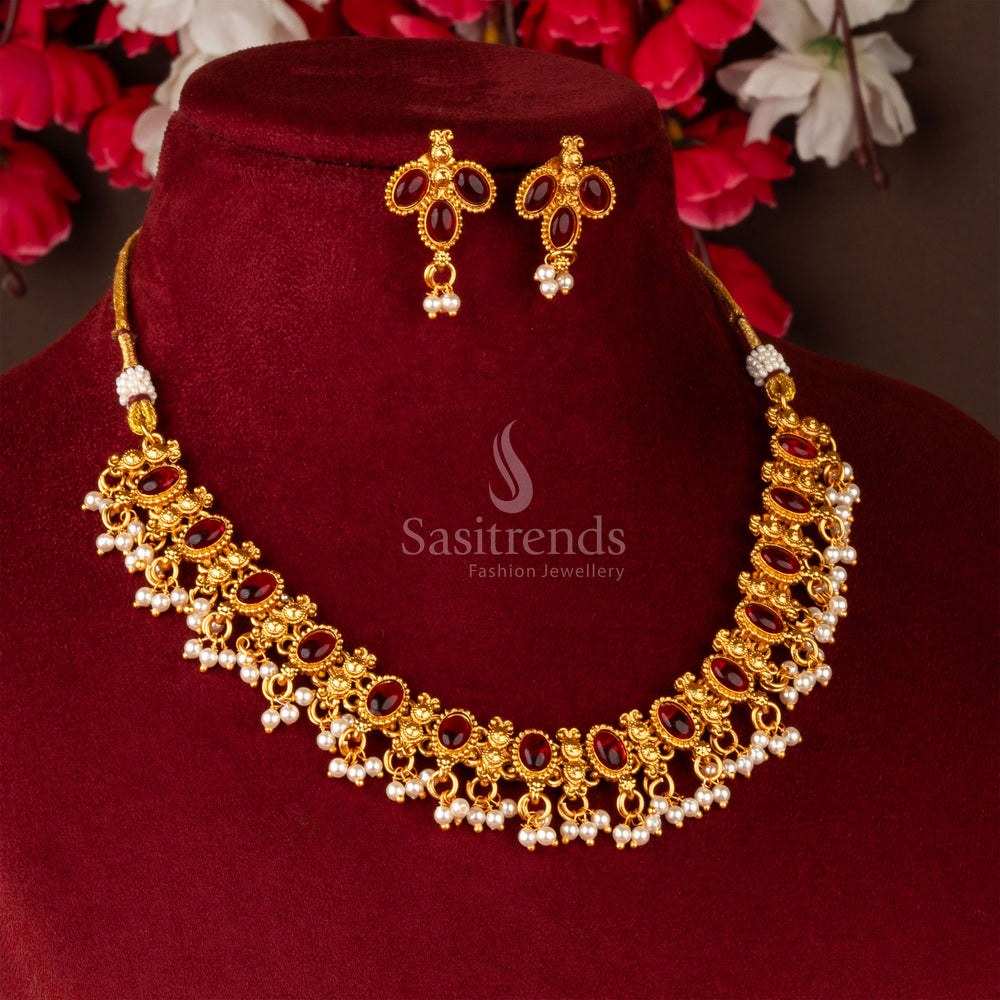 Regal matte gold plated necklace with bold ruby Kemp accents and heritage design, paired with festive earrings – a statement traditional jewellery set – sasitrends
