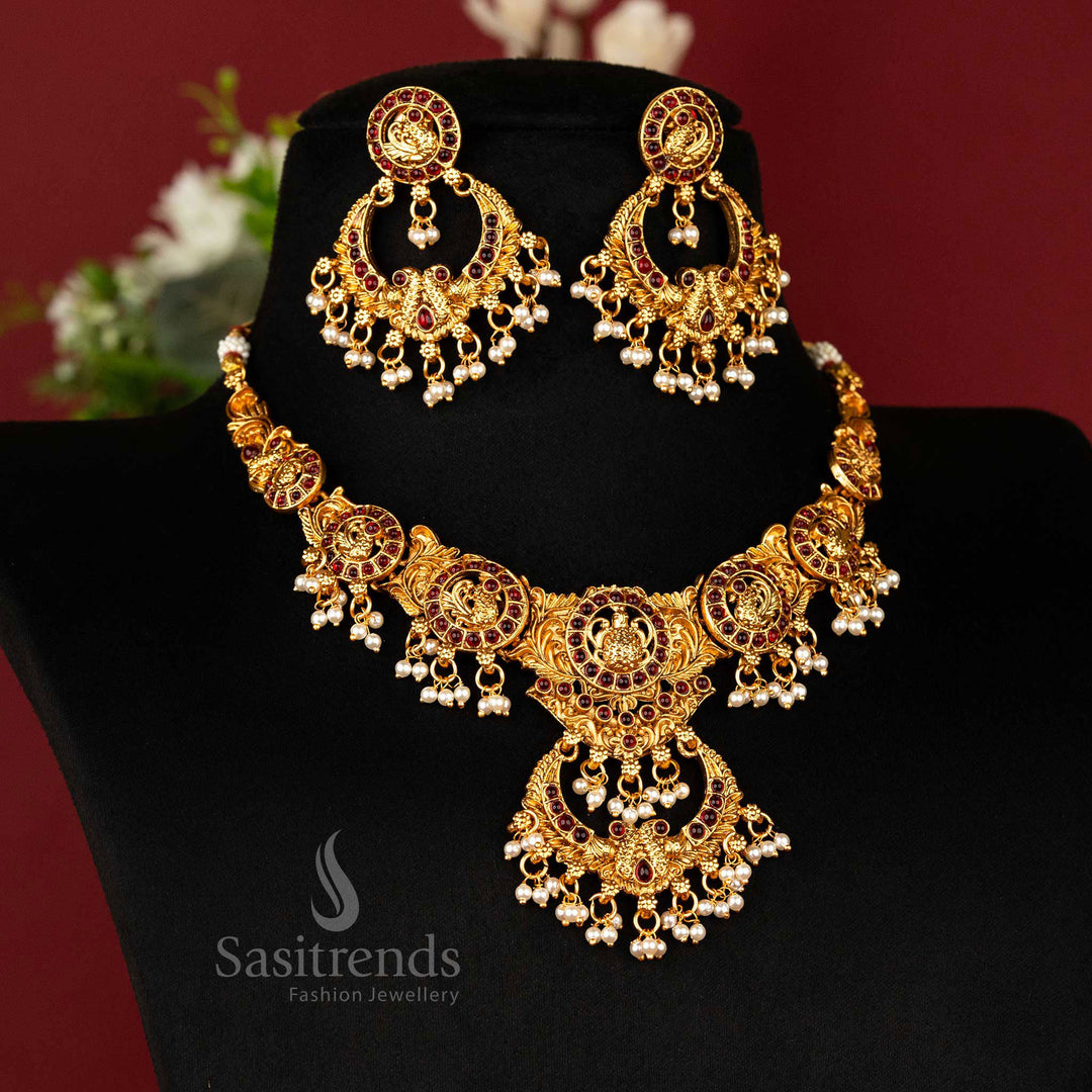 Regal matte gold-plated peacock temple necklace with chandbali pendant and rich ruby Kemp stones – graceful traditional wear jewellery – sasitrends