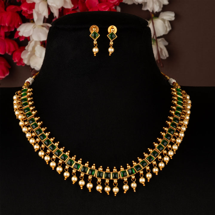 Traditional matte gold necklace with green square stones and pearl detailing – a rich jewellery design for ethnic occasions – sasitrends