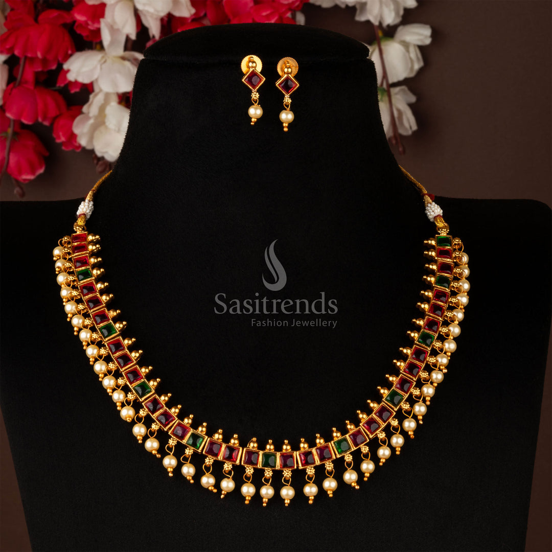 Elegant matte gold necklace with dual-tone ruby-green stones and pearl connects – vibrant festive jewellery with a heritage vibe – sasitrends