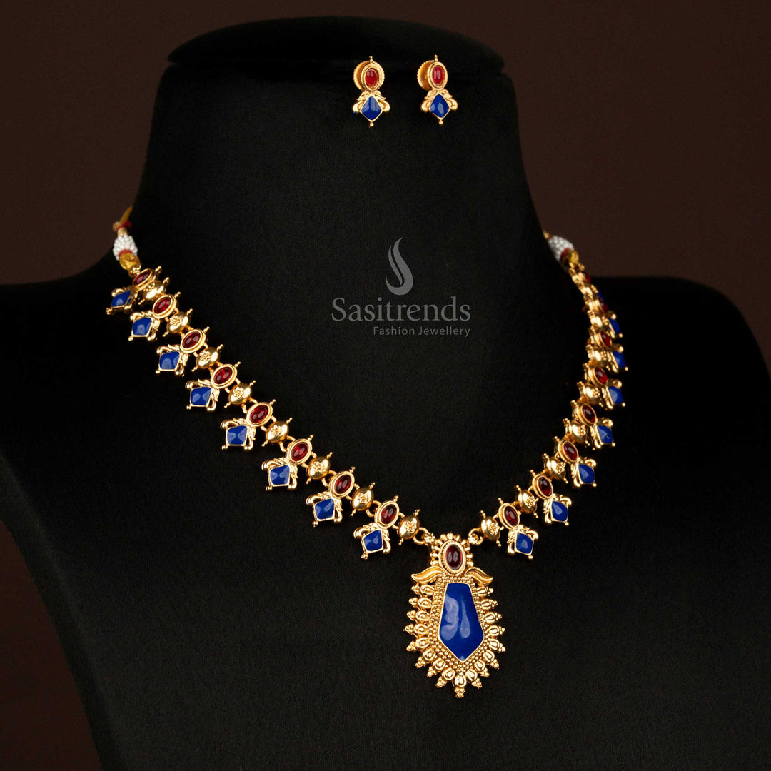 Elegant ruby-blue temple jewellery necklace with matte gold plating, floral pendant, and dazzling oval-cut drops – ideal for cultural occasions and saree wear – Sasitrends