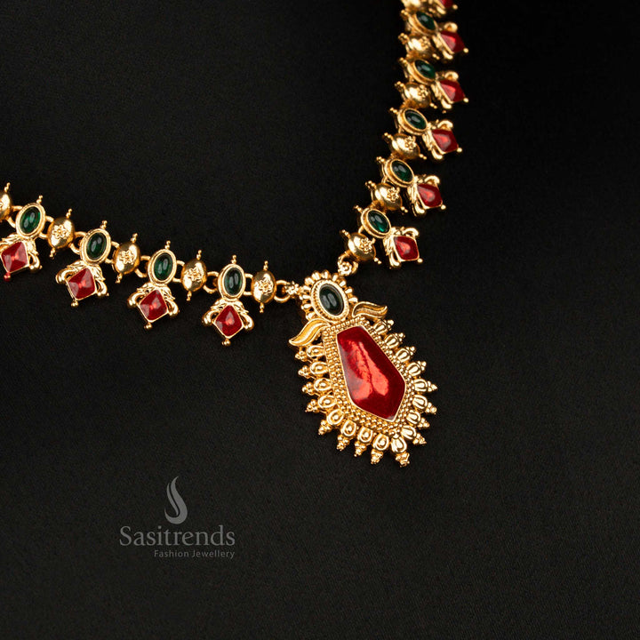 Traditional green-red pendant necklace set in matte gold with floral oval-cut stones and pear-shaped centre – classic bridal jewellery perfect for ceremonial wear – Sasitrends