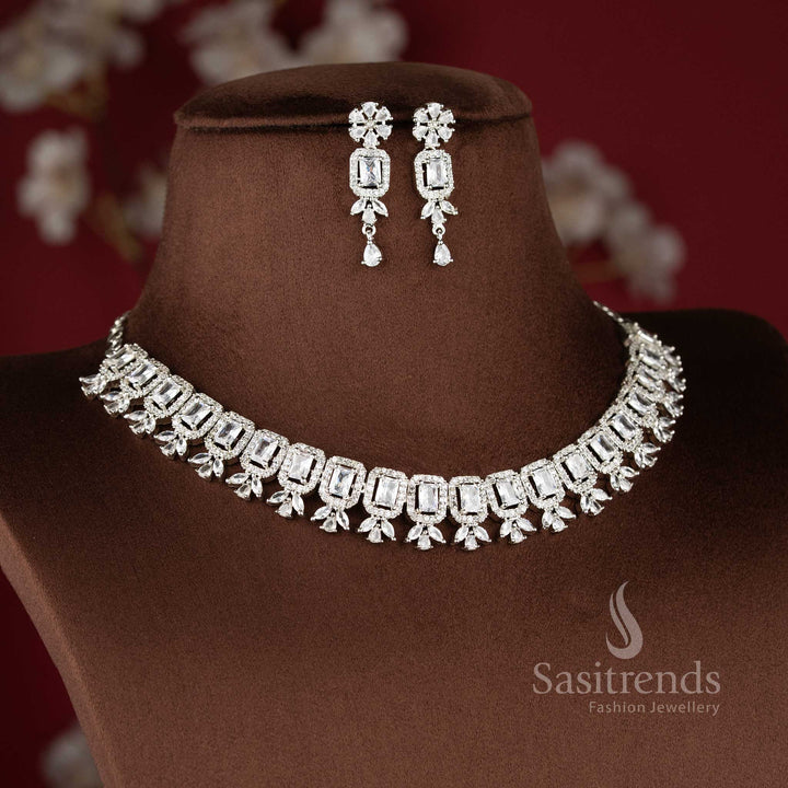 Elegant white American Diamond drop earrings with a floral stud and a rectangular stone centerpiece in a rhodium silver finish 2021A - Sasitrends