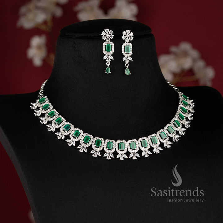 Rhodium silver plated party wear necklace set featuring a repeating sequence of vibrant green emerald-cut American Diamonds framed by brilliant white stone halos - Sasitrends