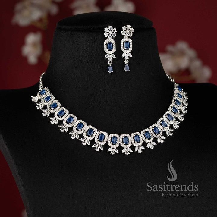 Elegant blue American Diamond drop earrings with a brilliant floral stud and a rectangular blue stone centerpiece set in silver-toned rhodium 2021D - Sasitrends