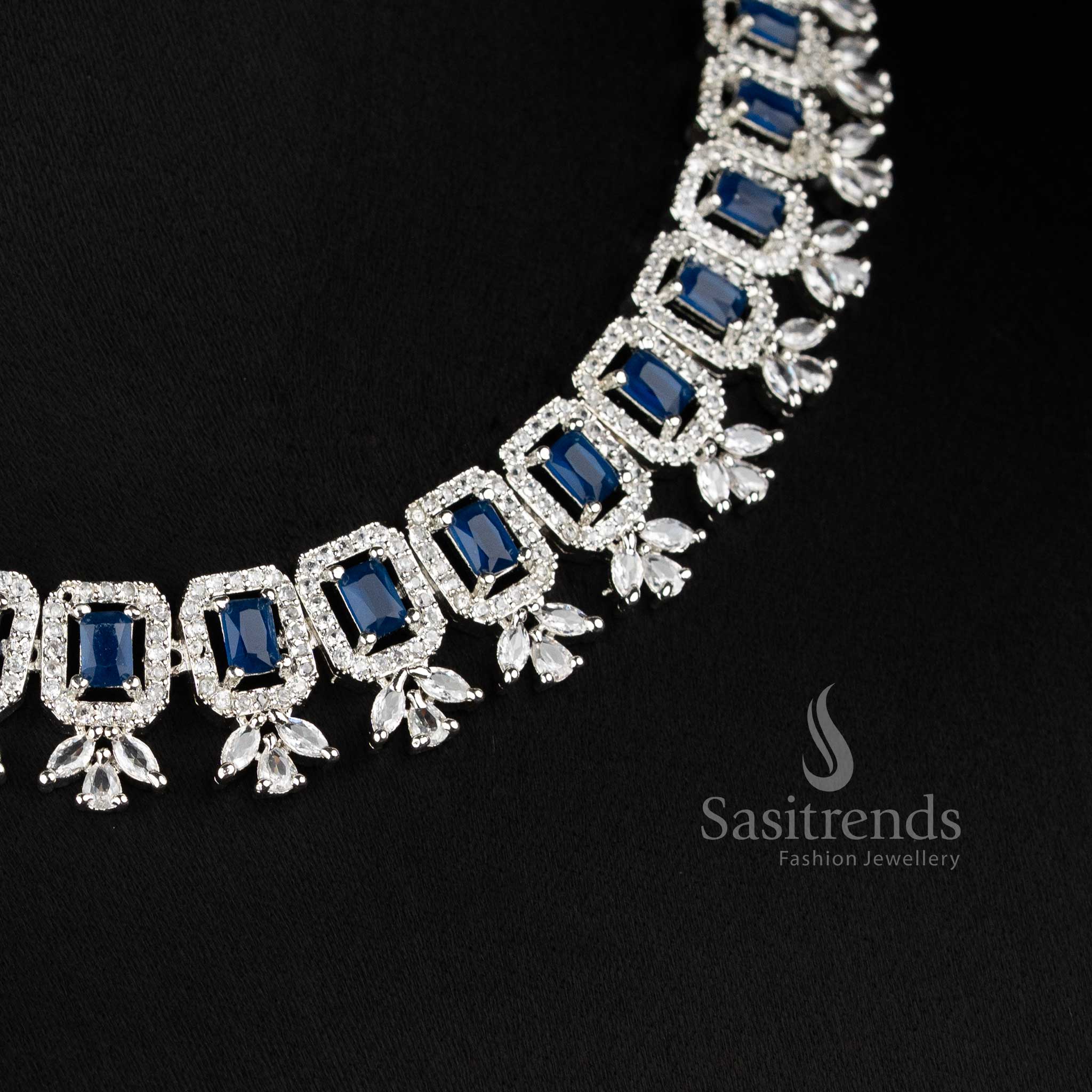 Elegant blue American Diamond drop earrings with a brilliant floral stud and a rectangular blue stone centerpiece set in silver-toned rhodium 2021D - Sasitrends