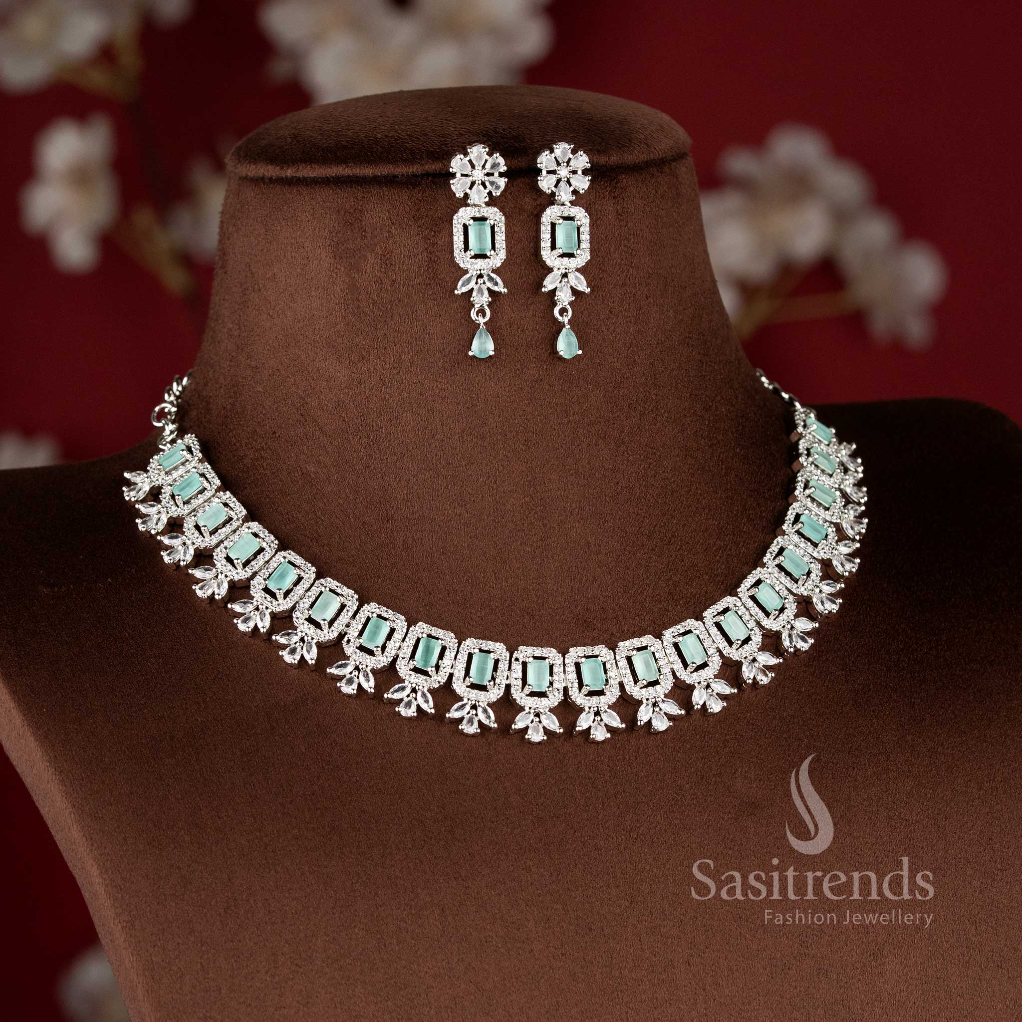 Elegant Mint Green American Diamond Drop Earrings with a floral stud and a rectangular mint stone centerpiece in a rhodium silver finish 2021F - Sasitrends