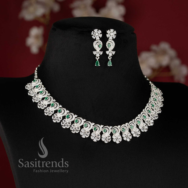 Trendy green stone studded rhodium plated necklace set with detailed floral pattern - Sasitrends