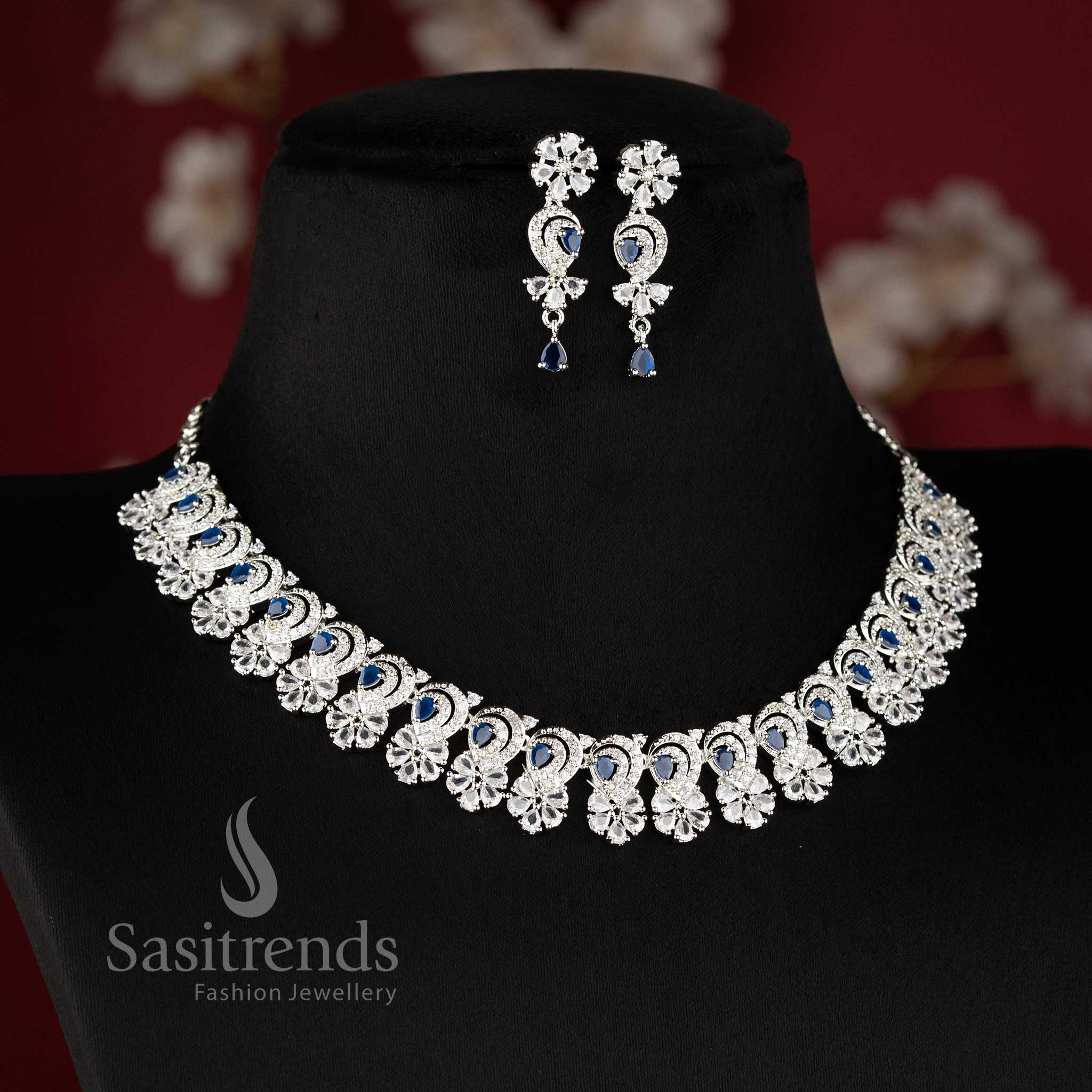 Blue color rhodium silver plated floral necklace set with American diamond stones for party wear by sasitrends