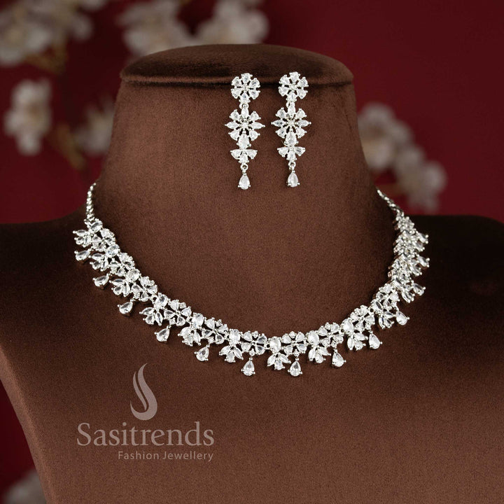 Elegant white AD stone floral cluster drop necklace set with dangling teardrop design for saree and reception wear - sasitrends