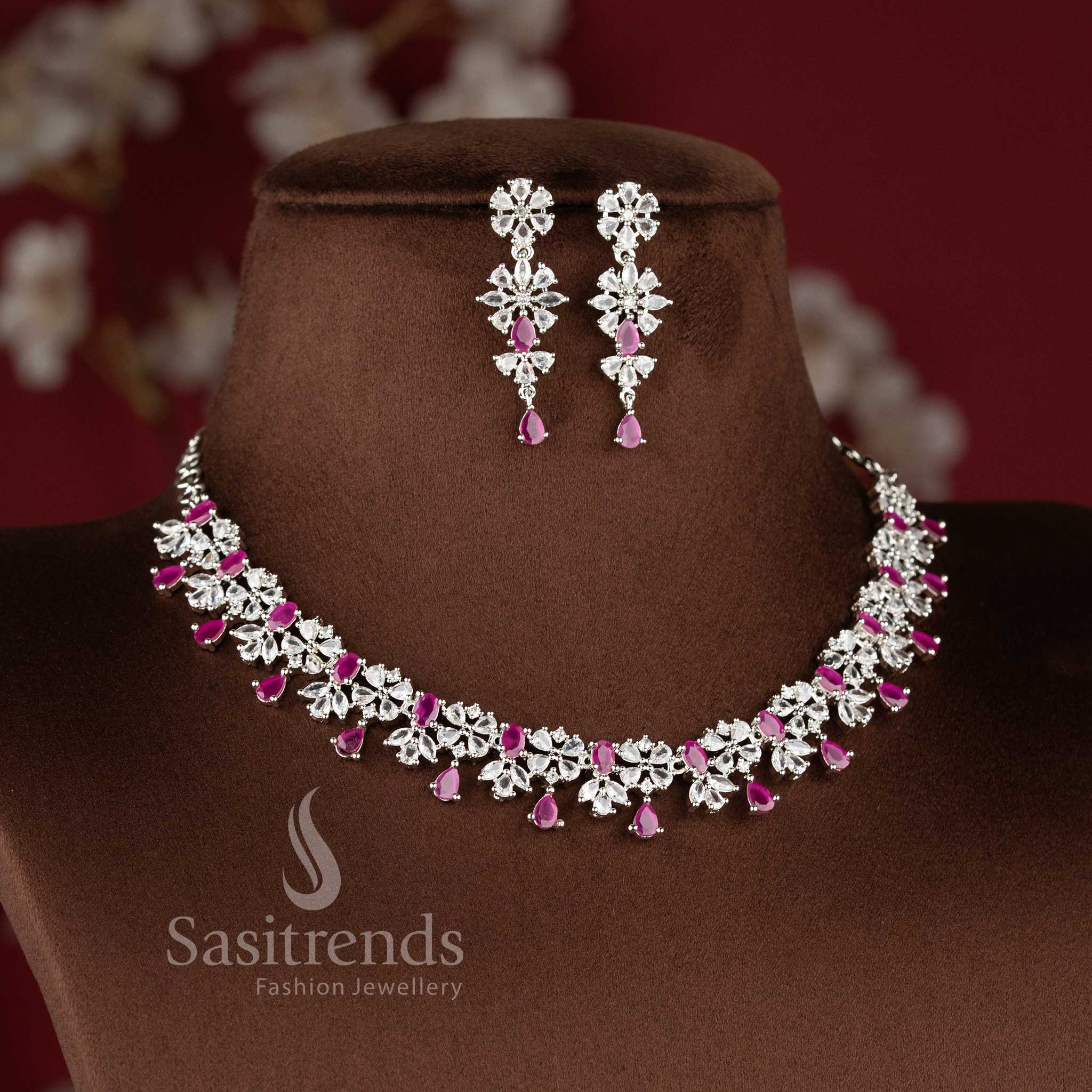 Ruby color rhodium plated floral American diamond necklace set with teardrop danglers for bridal wear - sasitrends
