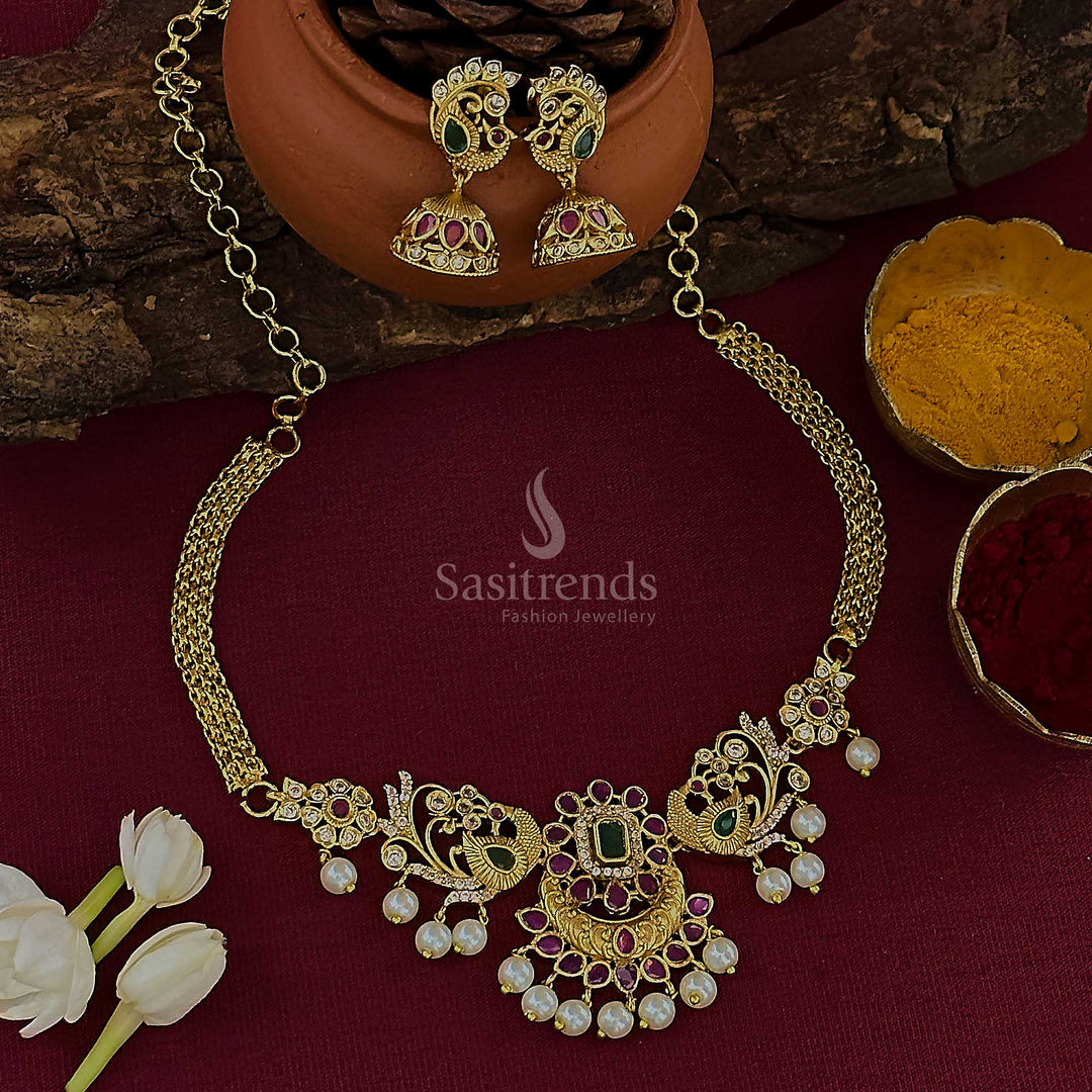 Regal chandbali peacock choker jewellery set crafted in temple matte gold plating, detailed with ornamental AD stones and finished with traditional pearl drops for a timeless festive allure – Sasitrends