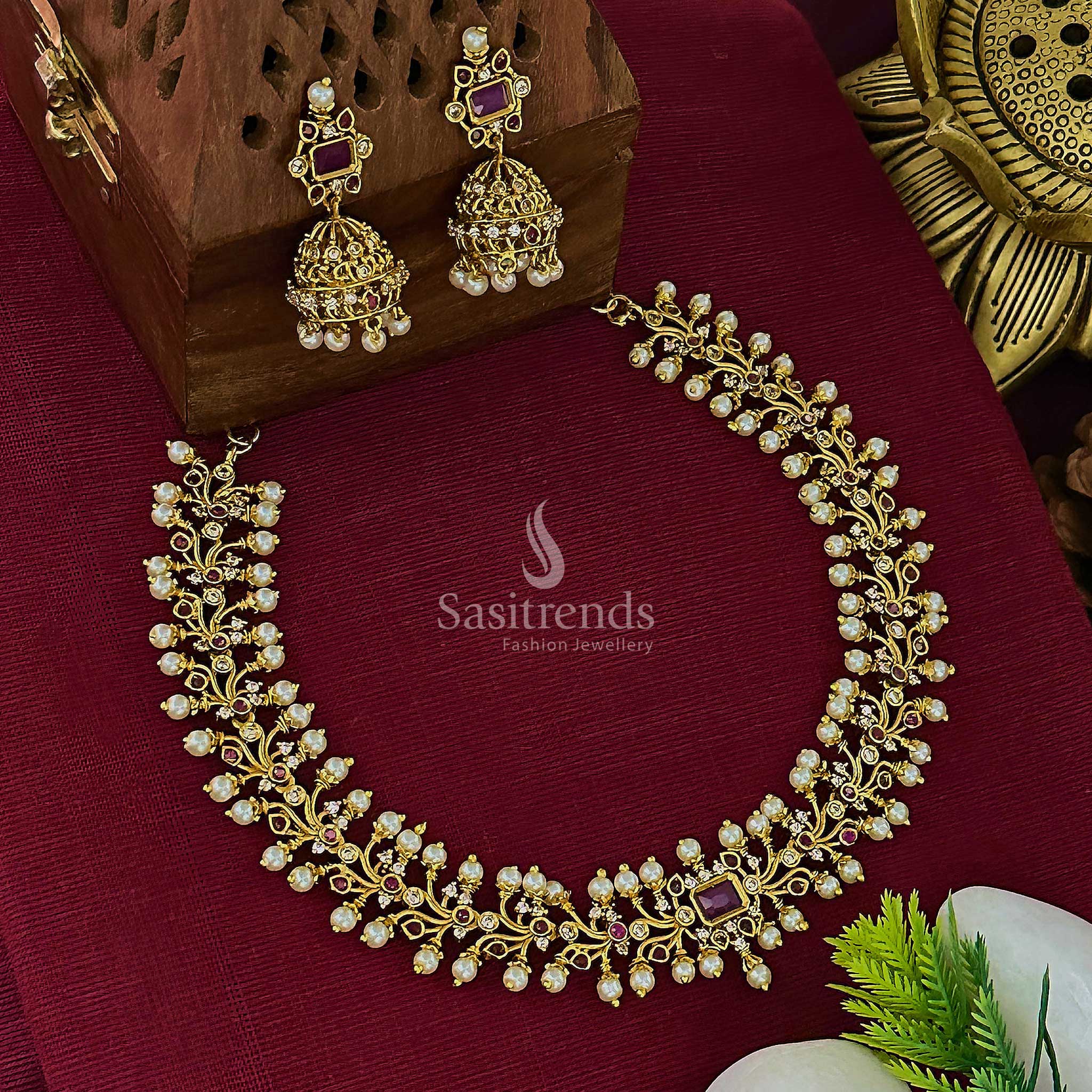 Grand temple matte gold plated floral choker jewellery set with centre ruby kemp stone and matching jhumkas, ideal for bridal festivities and cultural elegance – Sasitrends