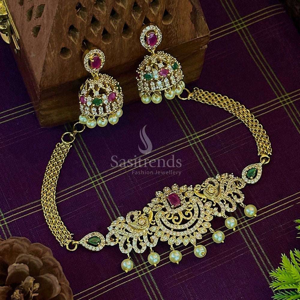 Vibrant temple matte gold tone choker jewellery set with colourful multi-stone AD accents, artistic peacock motifs, delicate pearl hangings, and ornate festive jhumkas – a statement piece for joyful ethnic celebrations – Sasitrends
