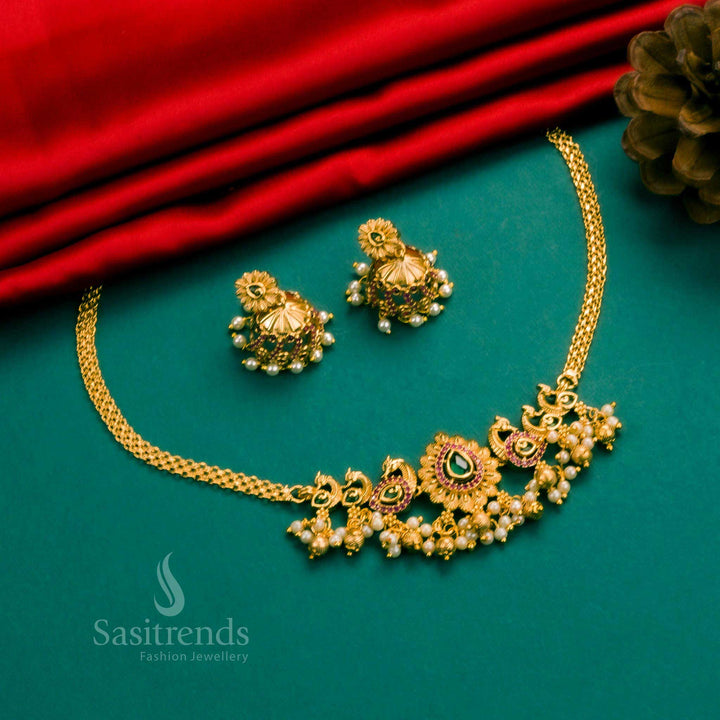 Vibrant ruby-green temple choker with graceful peacock artistry, embedded with American diamonds and matching festive jhumkas – Sasitrends