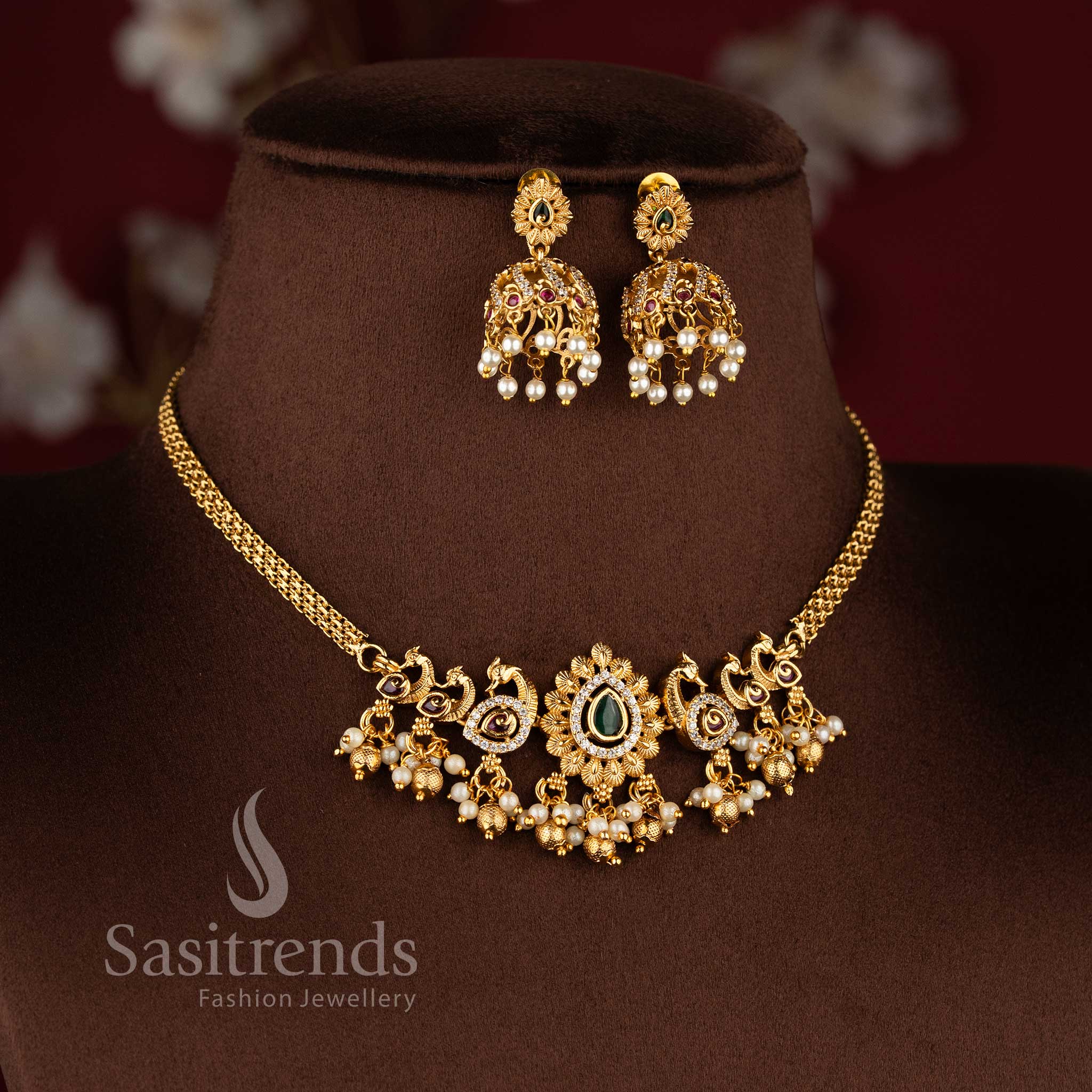 Traditional matte gold plated peacock choker necklace set with jhumkas and AD stones in multi color by Sasitrends.