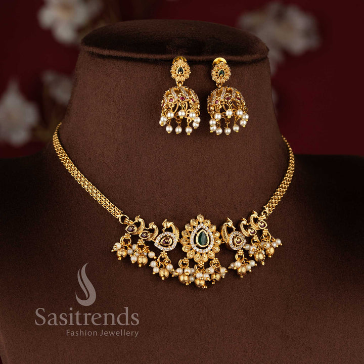 Traditional matte gold plated peacock choker necklace set with jhumkas and AD stones in multi color by Sasitrends.
