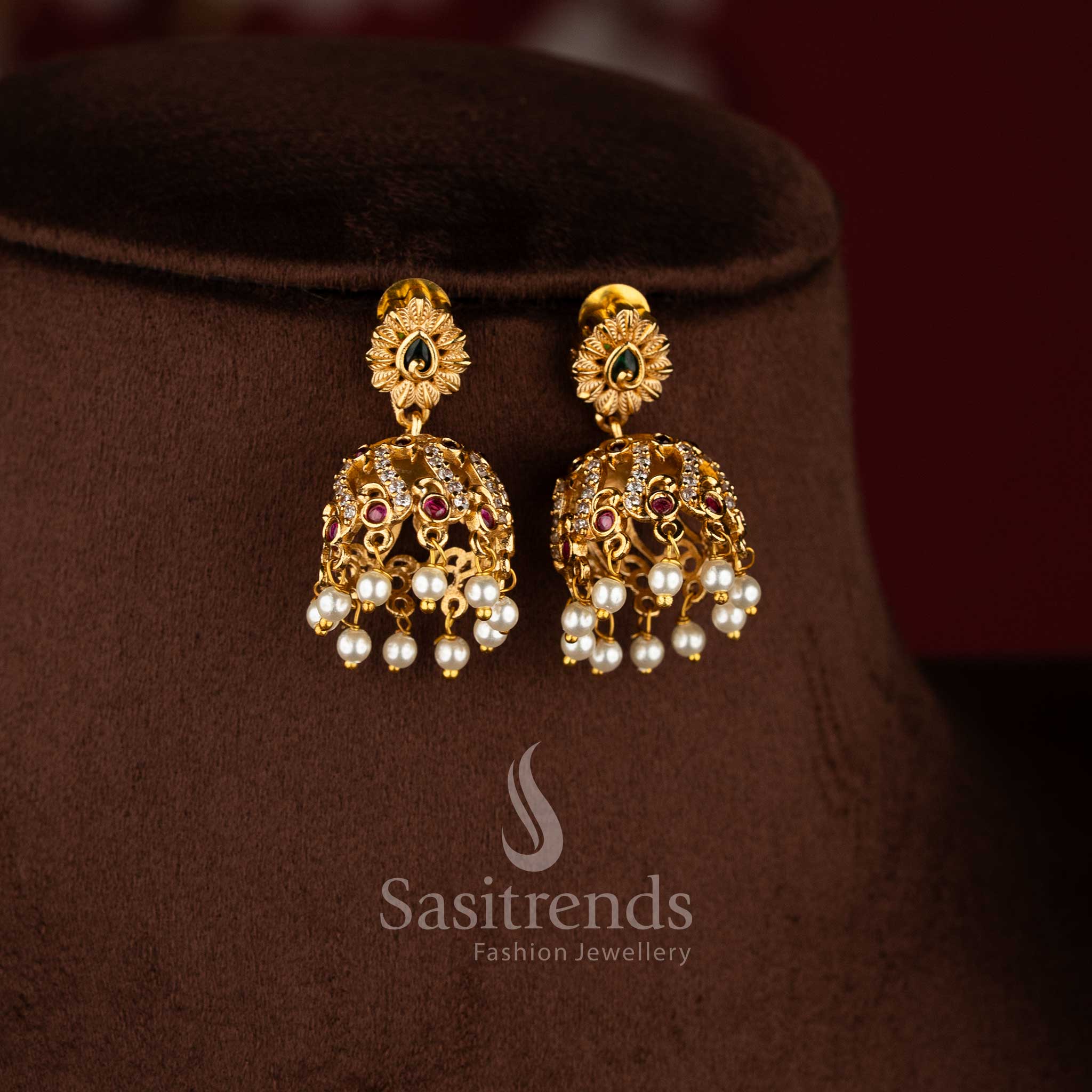Bridal matte gold peacock necklace set with AD stones and jhumkas in multi color combination.