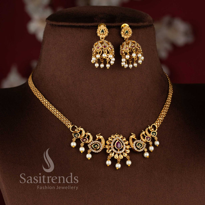 Bridal matte gold peacock necklace set with AD stones and jhumkas in ruby green combination
