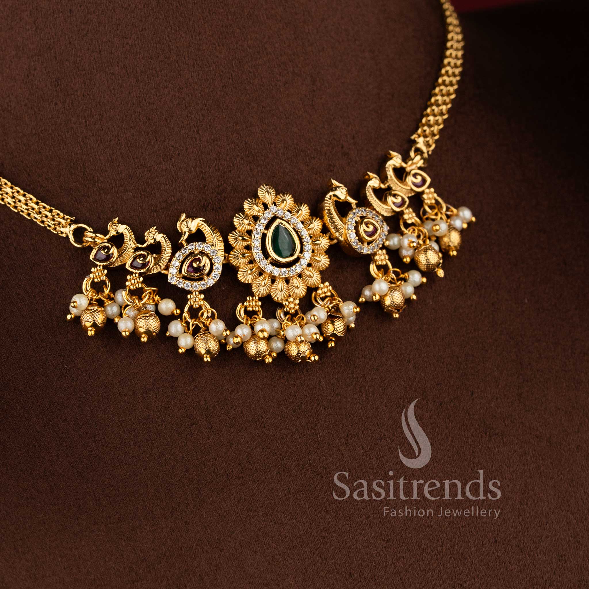 Traditional matte gold plated peacock choker necklace set with jhumkas and AD stones in multi color by Sasitrends.