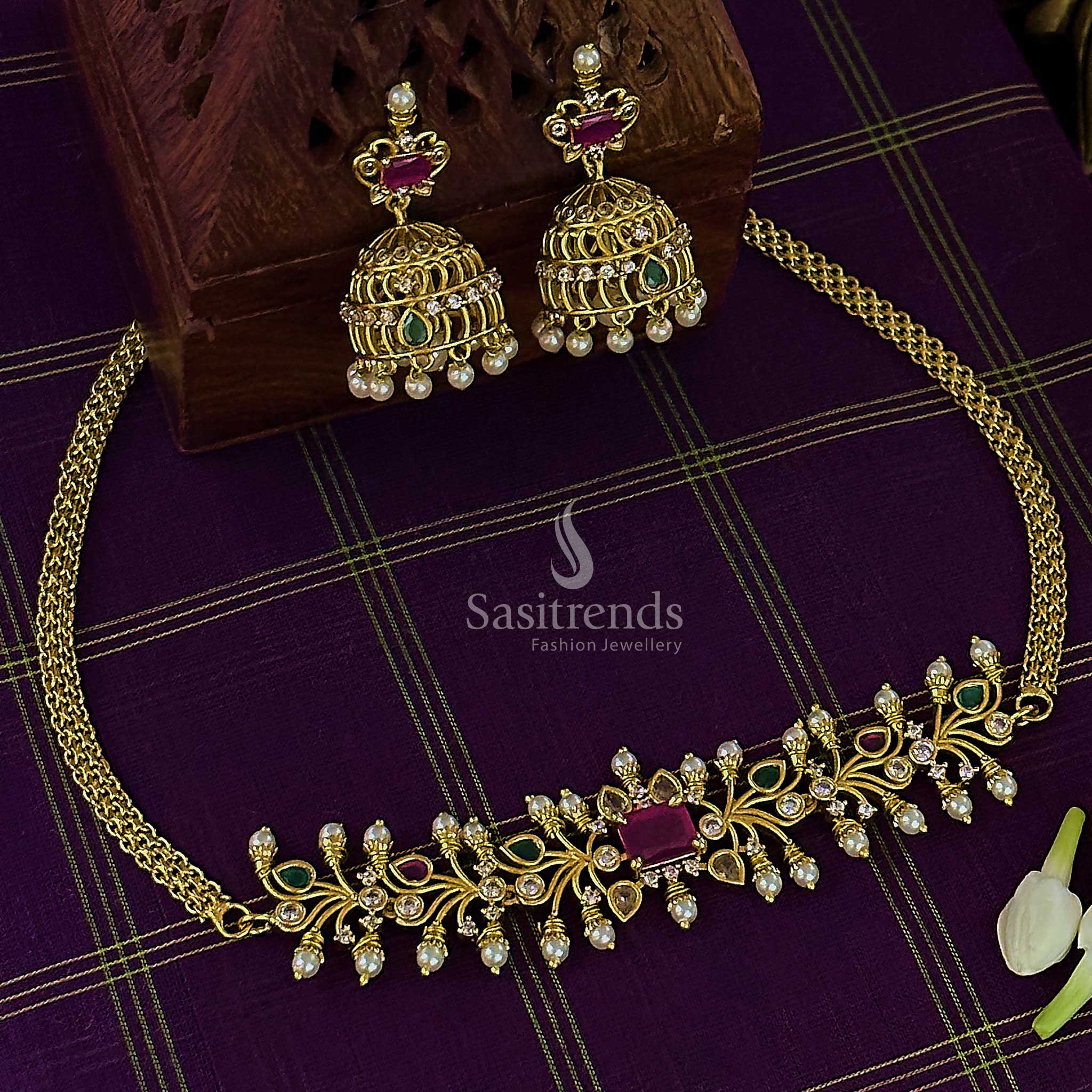 Vibrant multi-stone temple choker jewellery set in matte gold finish with artistic AD accents and elegant pearl drop jhumkas perfect for festive occasions – Sasitrends