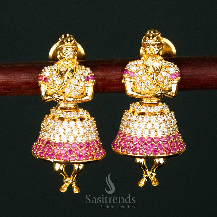 Stunning white-ruby American Diamond gold-plated brass jhumka earrings, ideal for bridal and grand traditional occasions - Sasitrends