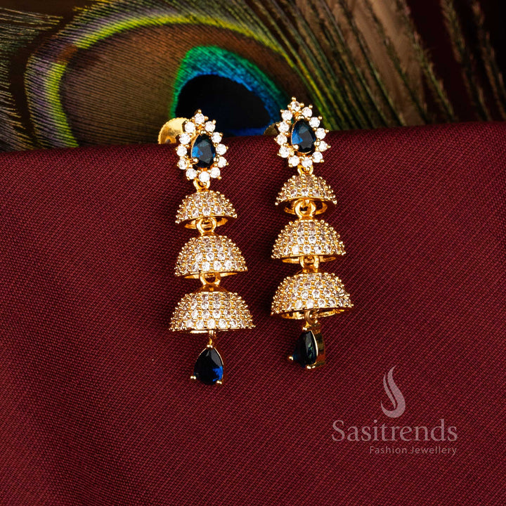 Elegant Triple Tier Bell Gold Plated Brass Jhumka Earrings with American Diamonds for Festive Wear – Sasitrends