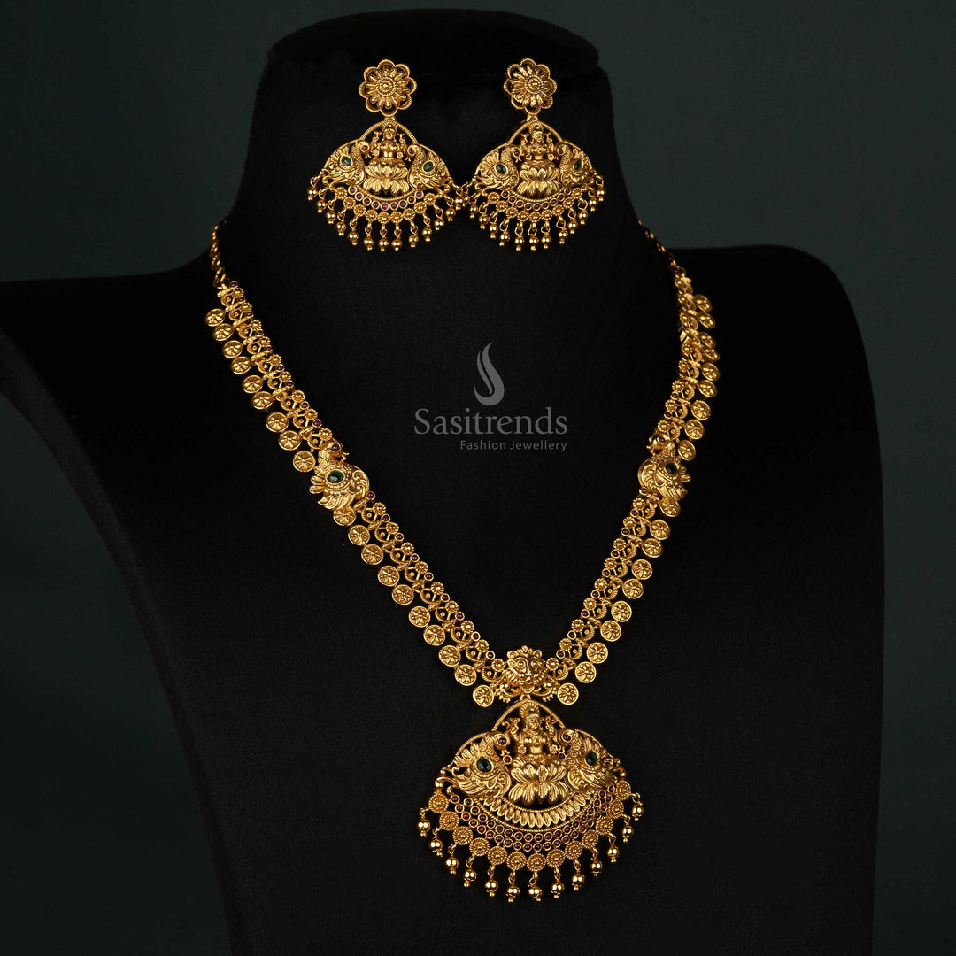 Traditional temple bridal necklace set with a Lakshmi and peacock pendant, decorated with American diamonds and a matte gold finish - Sasitrends