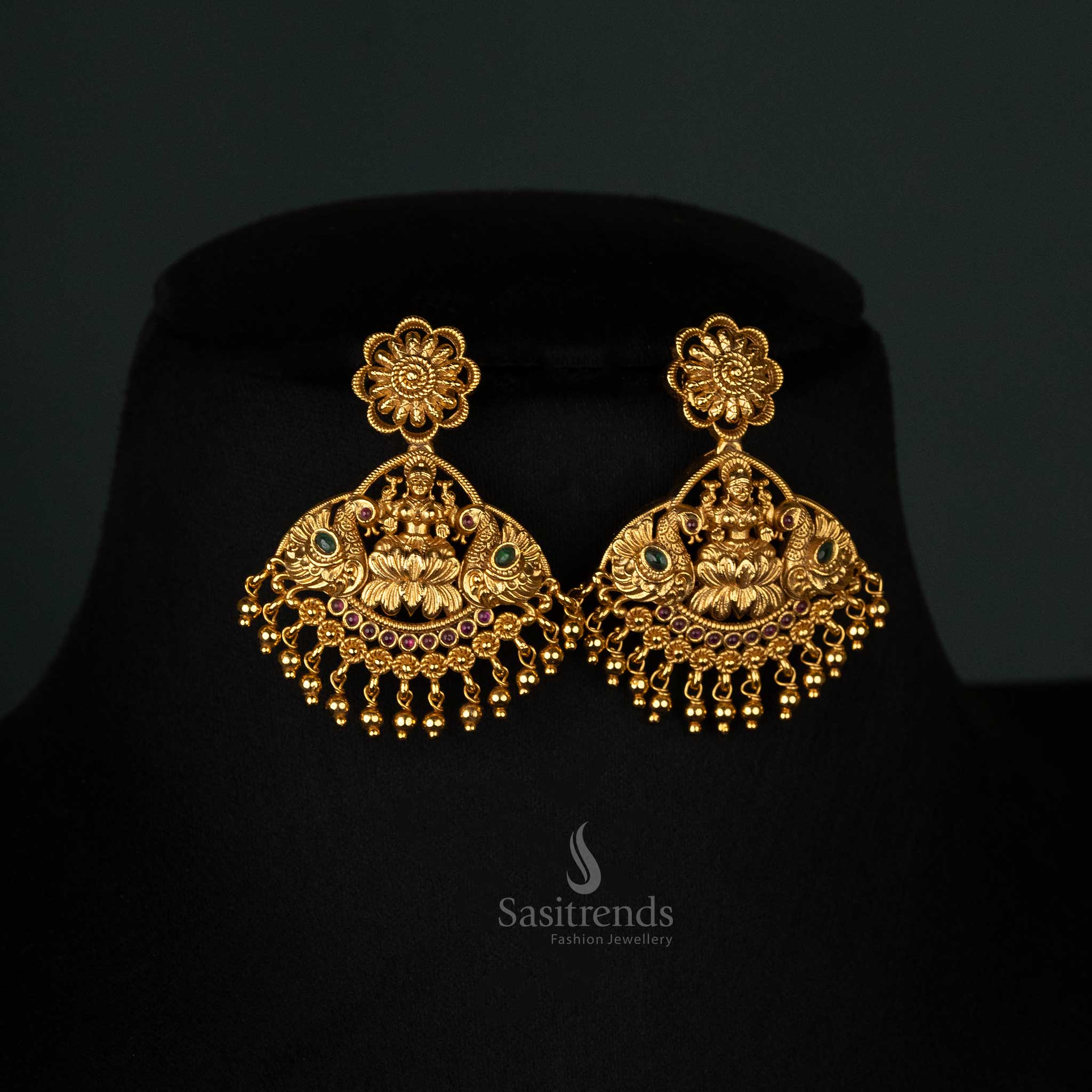 Exquisite temple-design long jewellery set featuring Lakshmi and peacock motifs, enhanced with AD stones - Sasitrends