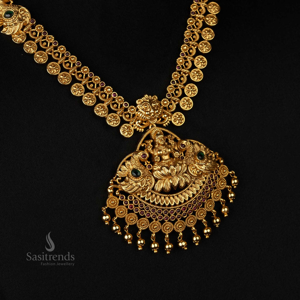 Exquisite temple-design long jewellery set featuring Lakshmi and peacock motifs, enhanced with AD stones - Sasitrends