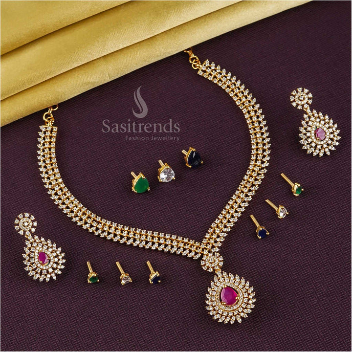 Versatile Broad Tilak Interchangeable Matte Gold Tone American Diamond Jewellery Set with Ruby, Green, Blue, and White Stones - Sasitrends