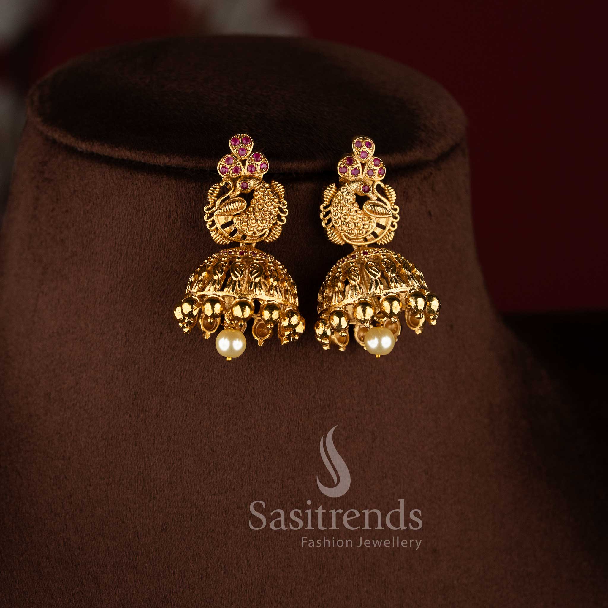 Temple matte gold peacock floral long haram necklace set with ruby stones and jhumkas.