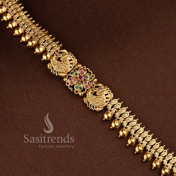 Grand bridal traditional matte gold peacock floral long necklace jewellery set with jhumkas in ruby green by Sasitrends.
