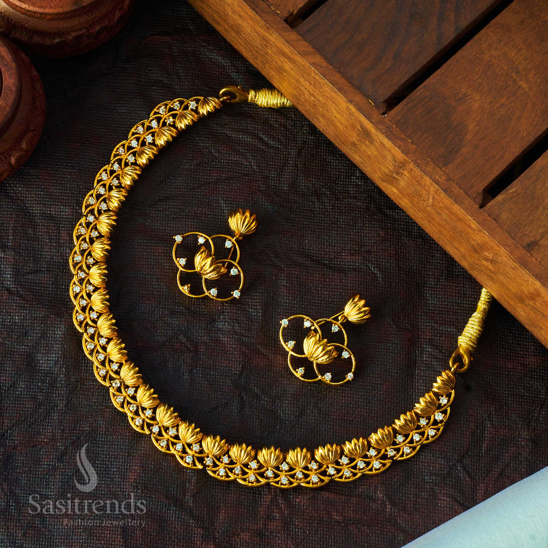 Devotional matte gold temple jewellery set highlighted with lotus floral carvings and brilliant American diamonds, perfect for traditional festivals, poojas, and sacred functions – timeless creation from Sasitrends