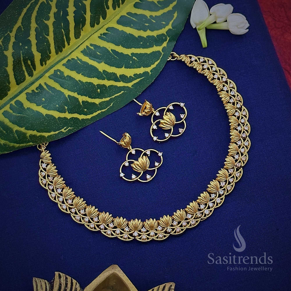 Heritage-inspired matte gold plated temple jewellery set adorned with lotus motifs and dazzling AD stones, handcrafted for cultural events and festive wear – symbolic and ornate design by Sasitrends
