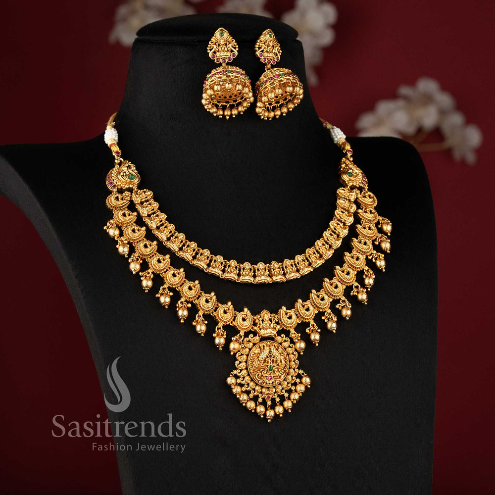 Close-up of the majestic circular pendant showing intricate peacock engravings and a seated Lakshmi deity in an antique matte gold finish 2073A - Sasitrends