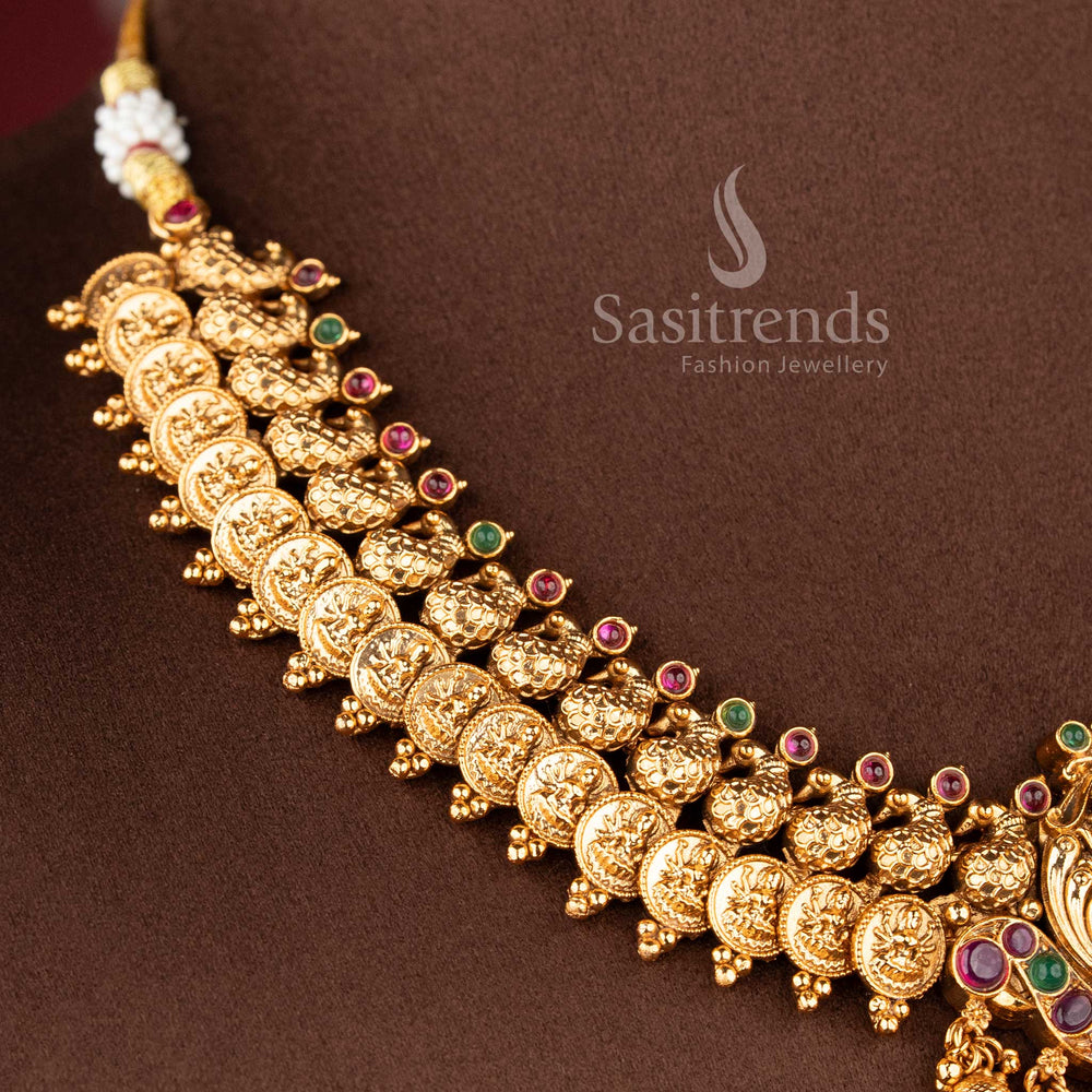 Close-up of the Lakshmi deity pendant accented with ruby and emerald kemp stones and a fringe of polished gold beads 2073B - Sasitrends