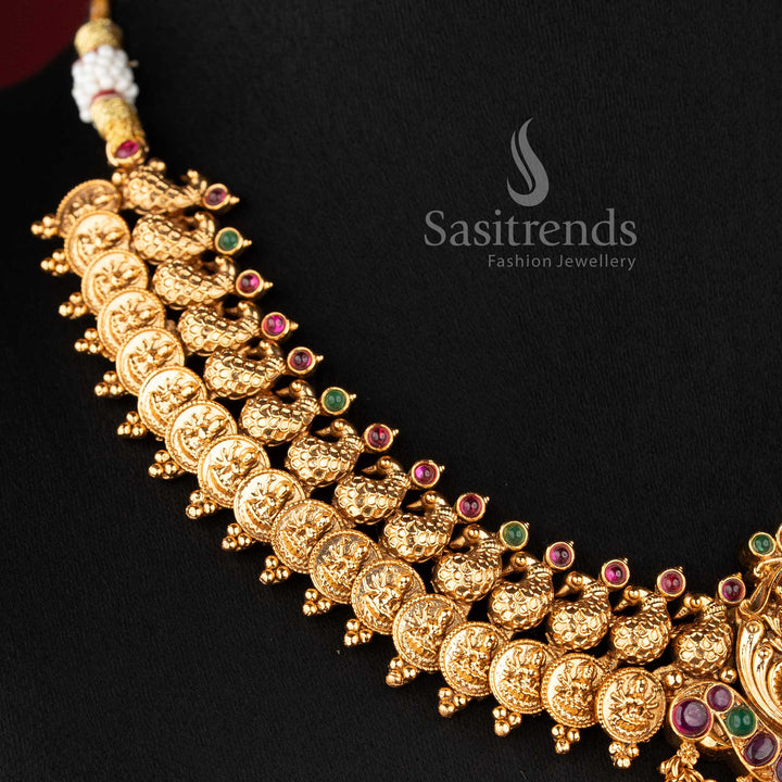 Close-up of the Lakshmi deity pendant accented with ruby and emerald kemp stones and a fringe of polished gold beads 2073B - Sasitrends