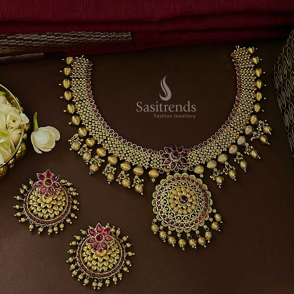 Royal ruby bridal floral jewellery set with matte gold temple plating, ethereal AD stones, and ornamental blossoms made for classic festive glamour – Sasitrends