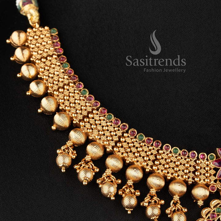 Grand south indian bridal necklace with ruby and green stone combination floral motifs and bead hangings sasitrends