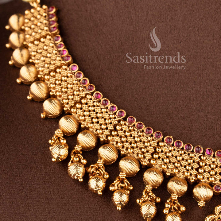 Ethnic matte finish temple jewellery set with ruby green stones central pendant and traditional design for bridal look sasitrends