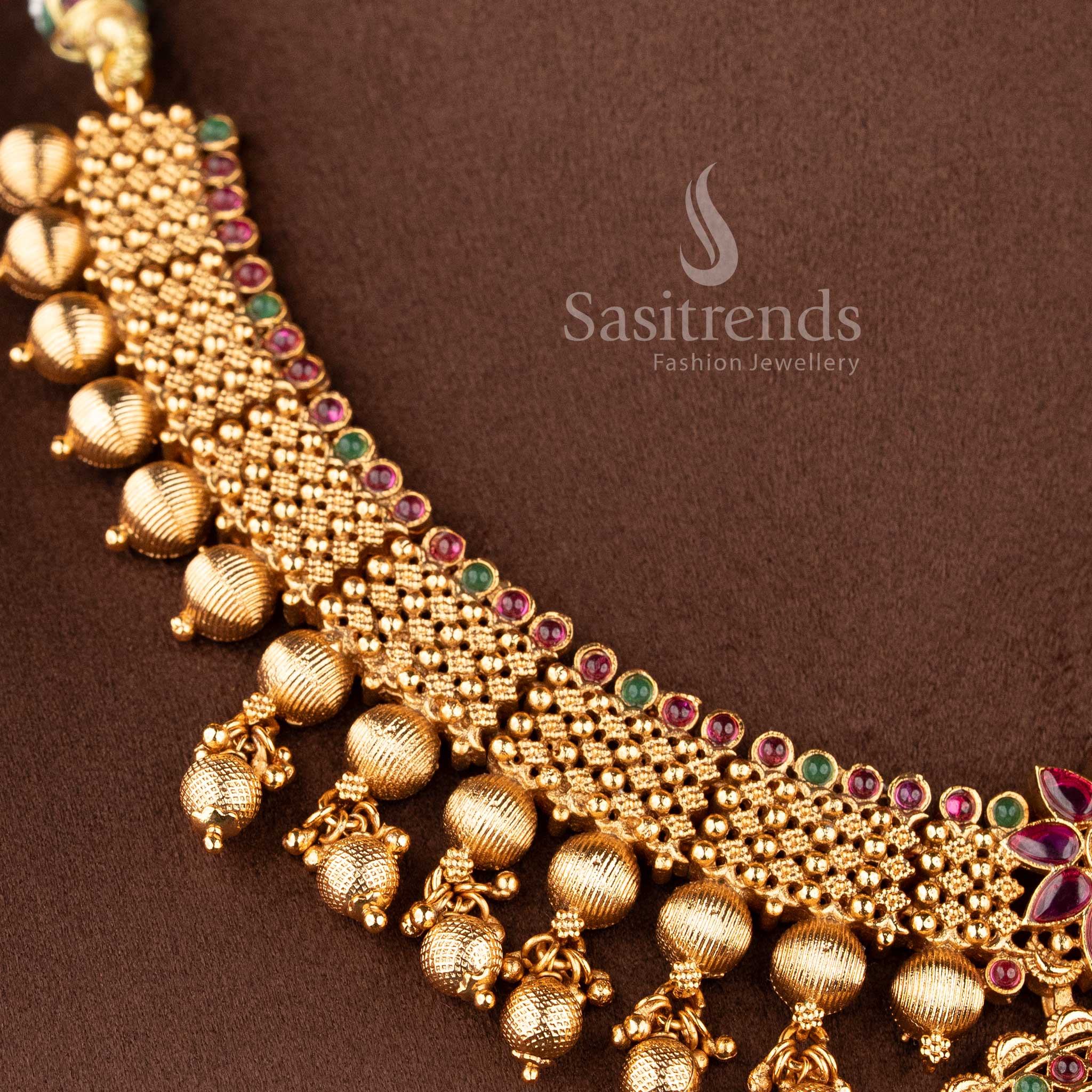 heavy bridal necklace set with ruby stone detailing floral craftsmanship and hanging beads for saree and lehenga sasitrends
