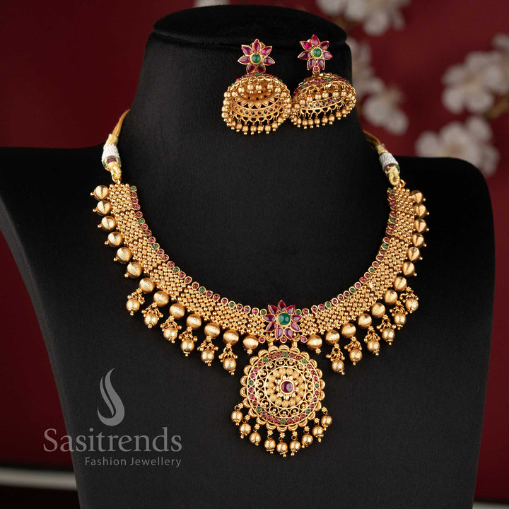 traditional temple matte gold plated bridal floral necklace set with ruby stones and matching jhumka earrings for wedding wear sasitrends