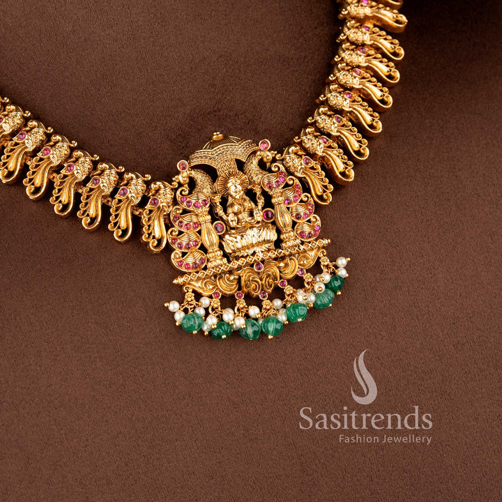 grand south indian bridal necklace with lakshmi and peacock motifs ruby stone detailing and bead hangings sasitrends